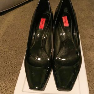 Black patent leather pumps